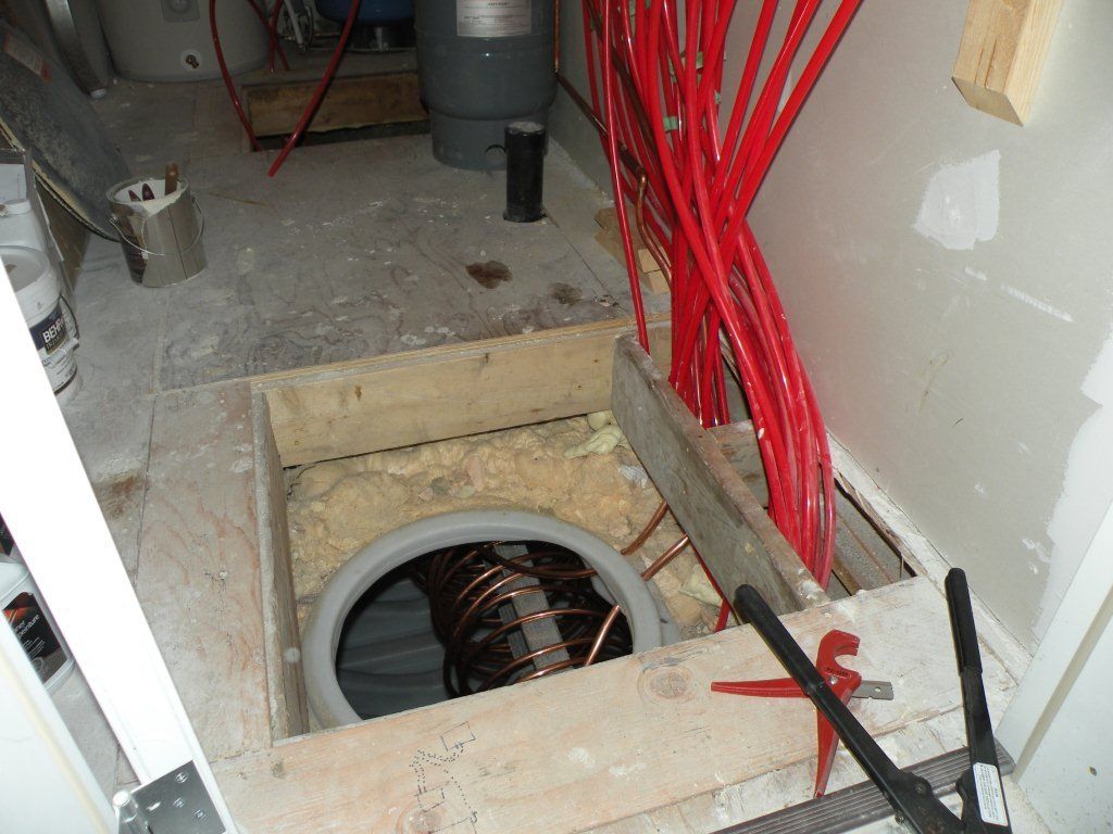 Solar hot water  storage tank below mechanical room